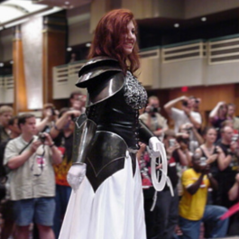 Valerie dressed in a cosplay costume being photographed at DragonCon